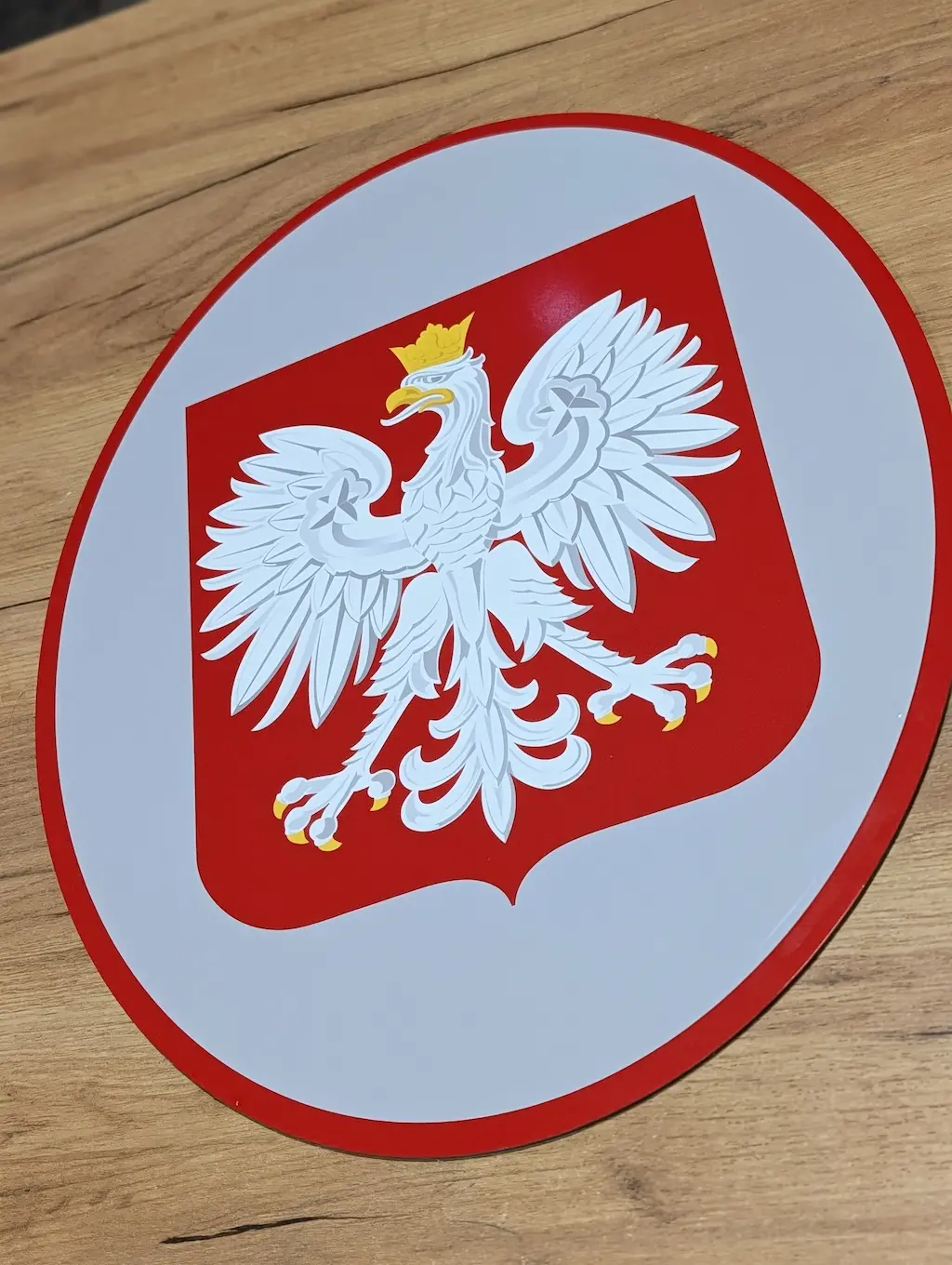 Owalna tablica urzędowa z godłem Polski z dibondu 50x40 cm dla Miejskiego Żłobka w Radomsku